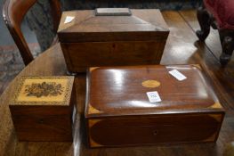 A mahogany and inlaid cigarette box, sarcophagus shaped tea caddy and a Tumbridge ware tea caddy.