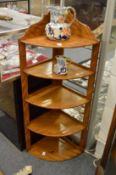 A satinwood five-tier corner shelf.