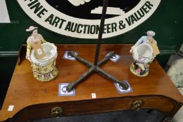 A pair of figural porcelain vases.