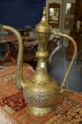 A large embossed brass Eastern ewer.