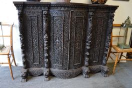 An impressive Indonesian carved hardwood four door sideboard or cabinet.