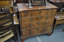 An 18th century walnut chest of three short and three long drawers (faults).