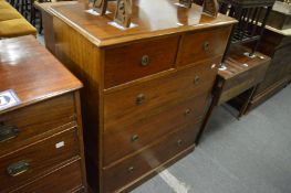 An Edwardian mahogany straight front chest of two short and three long drawers.