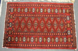 A small bokhara style rug, 93cm x 63cm.