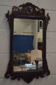 A Georgian design mahogany fretwork framed wall mirror.
