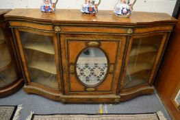A good Victorian figured walnut and ormolu mounted credenza with central mirrored door flanked by