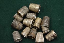 Silver and other thimbles.