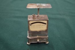 Silver postal scales.