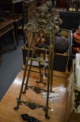 A pair of ornate brass easels.