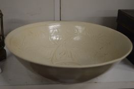 Chinese celadon bowl with incised decoration.