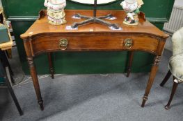 A 19th century mahogany single drawer side table with concave fronted drawer on turned supports.