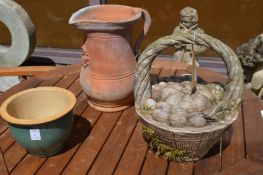 Terracotta jug, a planter and wooden garden ornament modelled as a basket.