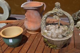 Terracotta jug, a planter and wooden garden ornament modelled as a basket.