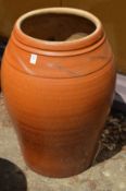 A large glazed planter or urn.