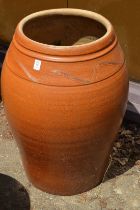 A large glazed planter or urn.