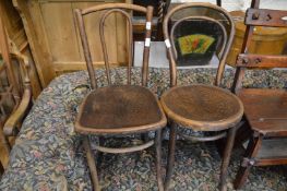 Two bent wood chairs.