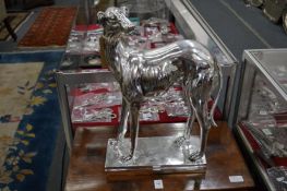 A silvered resin model of a whippet or greyhound.