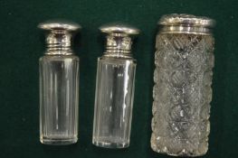 Silver mounted cut glass jars.