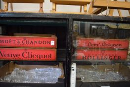 A pair of novelty Champagne storage boxes.