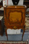 A 19th century French king wood parquetry and marquetry standing cabinet with a panelled door and