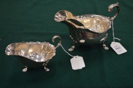 Two silver sauce boats.
