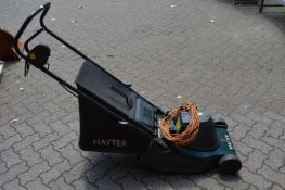 A Hayter Harrier 41 electric rotary lawn mower.