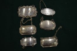 Silver and other decanter labels.