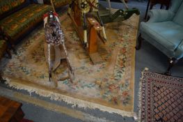 A Chinese carpet, beige ground with floral decoration, 300cm x 200cm.