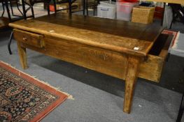 A small French farmhouse coffee table with two drawers.