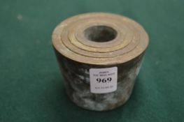 A set of bronze cup weights.