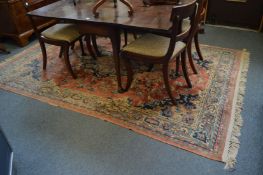 Persian style carpet, pink ground with floral decoration, 280cm x 182cm.