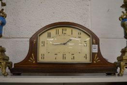 An Art Deco inlaid mahogany mantel clock.