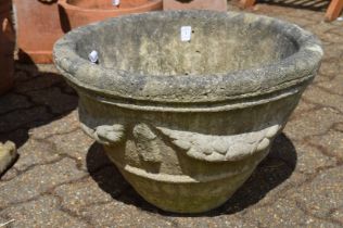 A reconstituted stone planter.