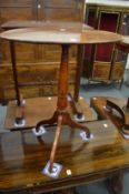 A 19th century mahogany oval tripod table.