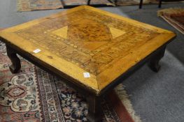 Decoratively inlaid low table.