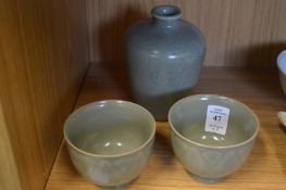 A pair of Chinese celadon bowls and a similar vase.
