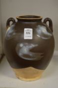 A Chinese brown glazed twin handled vase.