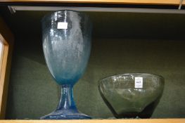 Green glass bowl and a large pedestal vase.