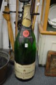 A very large empty bottle of Champagne!