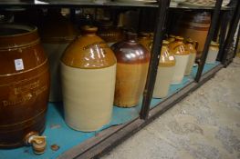 A collection of salt glaze and stoneware barrels, storage jars etc.