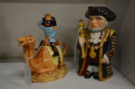 A novelty teapot and a toby jug.