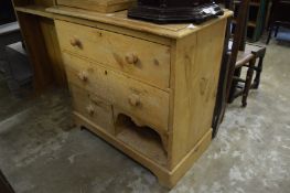 A pine chest of drawers.