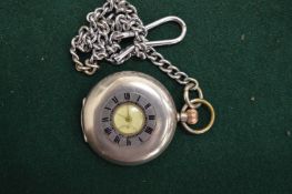 A silver half hunter pocket watch with plated chain.