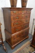 A 18th century walnut tall boy with three short and three long drawers to the upper section, the