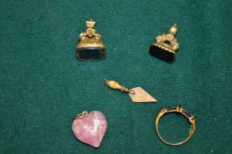 Two fob seals, miniature gold trowel, a ring and a pendant.
