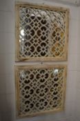 A pair of Moroccan style garden mirrors.
