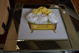 A decorative mirrored frame picture.