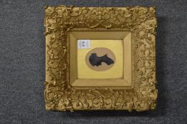 Gilt framed silhouette of a young lady.