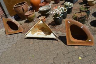 Three cast iron farmyard corner water troughs.