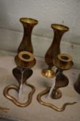 A pair of Cairo ware cobra candlesticks and similar vases.